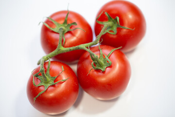 tomatoes on white background, food