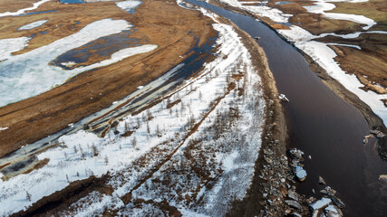 Spring flood, ice floes on the river, Landscape view on the shore of the river floating ice...