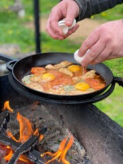 cooking meat on the grill mens hands 