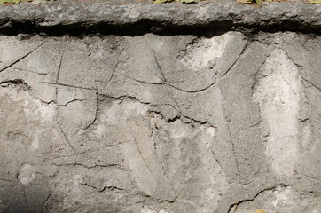 Obraz na płótnie Canvas old cracked concrete and stone wall
