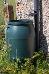 A full tank of rainwater under the gutter