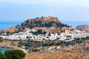 Fototapeta na wymiar Lindos town cityscape with acropolis over old town, Rhodes island, Greece