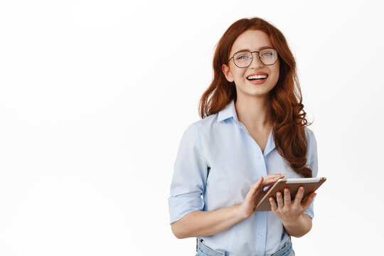 Smiling Business Girl, Office Worker In Glasses, Using Digital Tablet For Work, Laughing And Looking Happy, Standing Against White Background