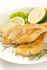 Pan-fried chicken breast on a solid background