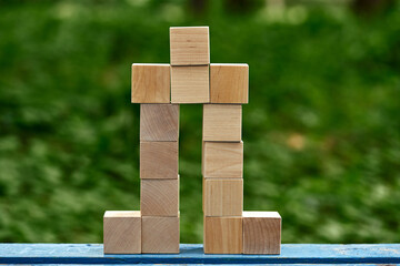 house made from wooden toy blocks on nature background