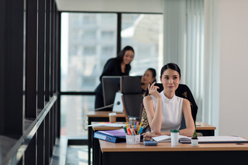 Portrait of young smiling businesswoman working in the office