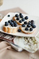 sandwiches on the table with fashion magazines fashion food