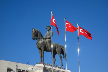 The statue of Ataturk and national flags of modern Turkey in Ulus - Ankara, Turkey	