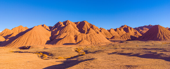 Fototapeta na wymiar Colorful eroded hills and badlands in the vicinity of Tolar Grande on the high altitude puna in northwest Argentina