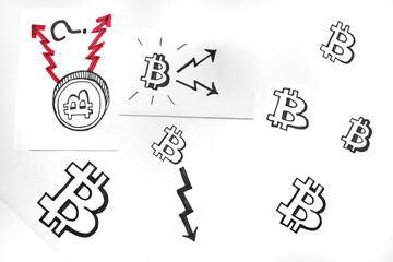 up and down trends in the world of Bitcoin cryptocurrency. Various Bitcoin Symbols Drawn on White Sheets with Arrows Displays growth and fall of bitcoin ..
