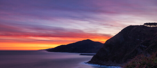 The Zarautz viewpoint during a purple sunset in long exposure