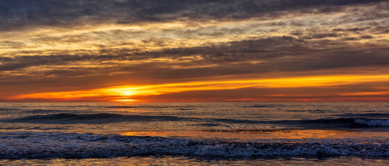 A beautiful and dramatic sunrise on the beach