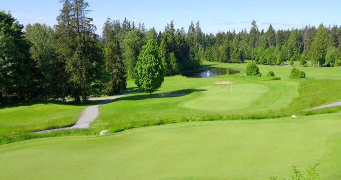 Establishing shot of Golf course with gorgeous green and fantastic forest view in Vancouver, Canada, North America. Day time on May 2021. Still camera. ProRes 422 HQ.