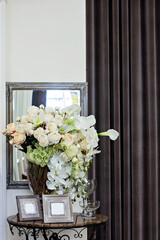Bouquets of flowers and frames for a photo. beautiful interior - 436734306