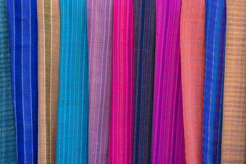 Handmade colorful Burmese fabric for sell in a tourist stall on the street market near Inle Lake in Burma, Myanmar