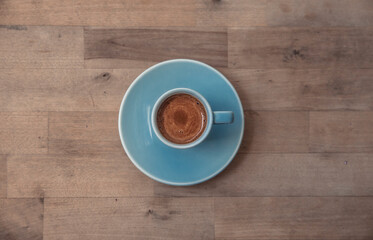 cup of coffee on wooden table