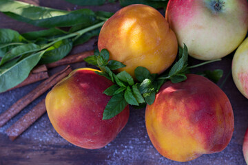 Peaches on a wooden background. - 436735559