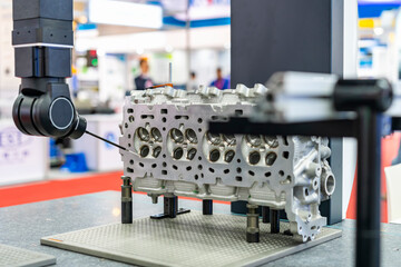 automatic coordinate measurement machine (CMM) during inspection automotive industrial part in...