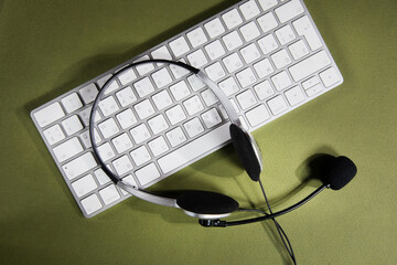 headphones on white keyboard