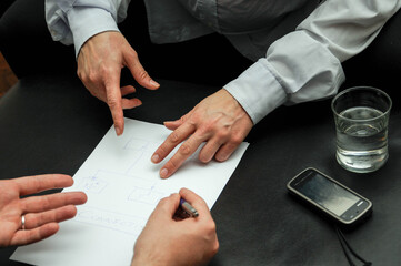 a woman and a man scheduling tasks in the office