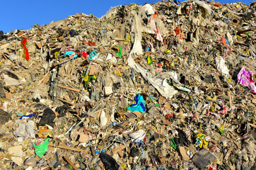 Garbage dump with construction waste. Trash disposal and food waste. Recycling of waste at junk yard. Dispose the rubbish in landfill. Trash disposal and rubbish dump with polution. Ecology concept