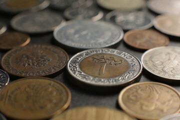 Many coins on a black background. Close up