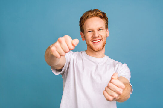 Portrait Of Nice Attractive Confident Cheerful Man Wearing Casual Holding In Hands Driving Invisible Car Isolated Over Blue Background