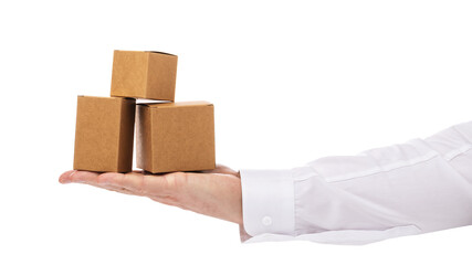 Three cardboard boxes of different sizes on the palm of a man isolated on a white background