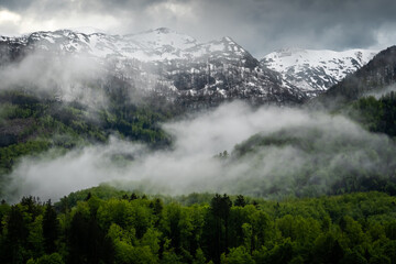 Mountains buried in fog around Lake Bohinj in Slovenia.