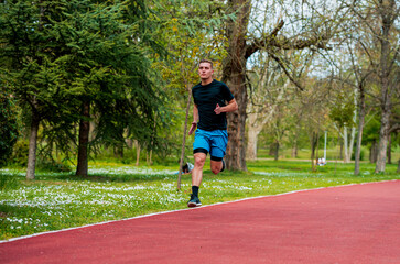 Healthy running runner man workout in the city park