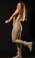 Beautiful slim body of woman in studio, black background