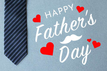 Happy Father’s Day concept idea, Happy Father’s Day sign on grey background with striped tie or cravat