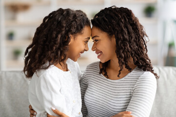 Closeup of loving african american family mother and daughter