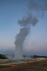 Old Faithful geyser eruption in Yellowstone National Park, Wyoming, USA