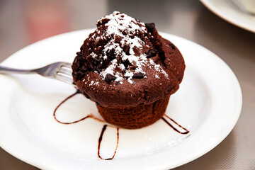 Homade chocolate brownies topped with chocolate sauce
