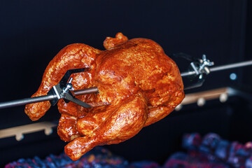 Ruddy fried chicken in spicy marinade grilled crispy close-up outdoors, night picnic party, barbecue concept