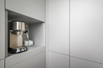 Modern gray kitchen corner with espresso coffee machine