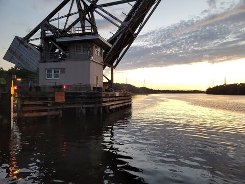 Drawbridge at sunset over river