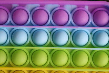 rainbow multicolor toy popit simple dimple for children anti-stress for relaxation very close-up