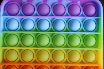 rainbow multicolor toy popit simple dimple for children anti-stress for relaxation very close-up