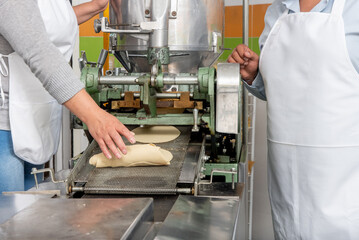 machine to make tortillas Mexican tortilleria with metal band and a kilo of tortillas wrapped in...
