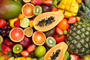 Naklejka na ściany i meble Many different delicious exotic fruits as background, top view