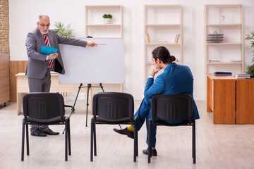 Two male employees in business meeting concept