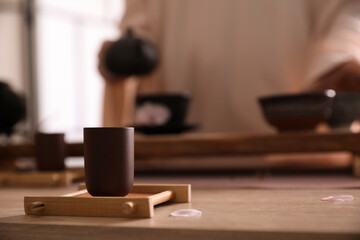 Fototapeta na wymiar Cup for traditional tea ceremony on wooden table