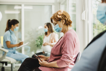 Senior Woman With Protective Face Mask At The Waiting Room