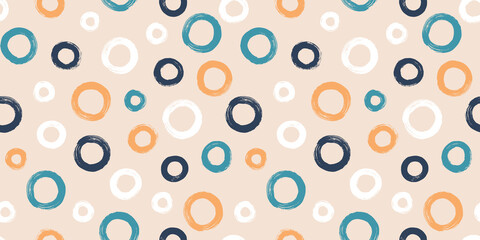 Colorful seamless pattern with rings in brush stroke technique. Vector abstract background with hand painted circles.