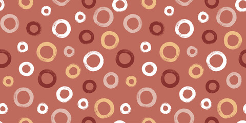 Colorful seamless pattern with rings in brush stroke technique. Vector abstract background with hand painted circles.