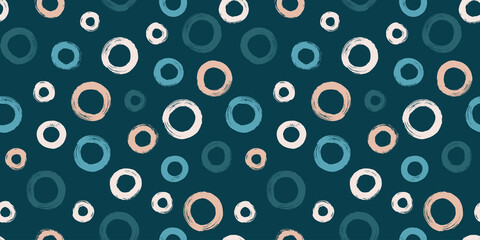 Colorful seamless pattern with rings in brush stroke technique. Vector abstract background with hand painted circles.