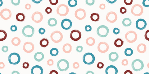 Colorful seamless pattern with rings in brush stroke technique. Vector abstract background with hand painted circles.