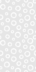 Black and white seamless pattern with rings in brush stroke technique. Abstract background with hand painted circles.
